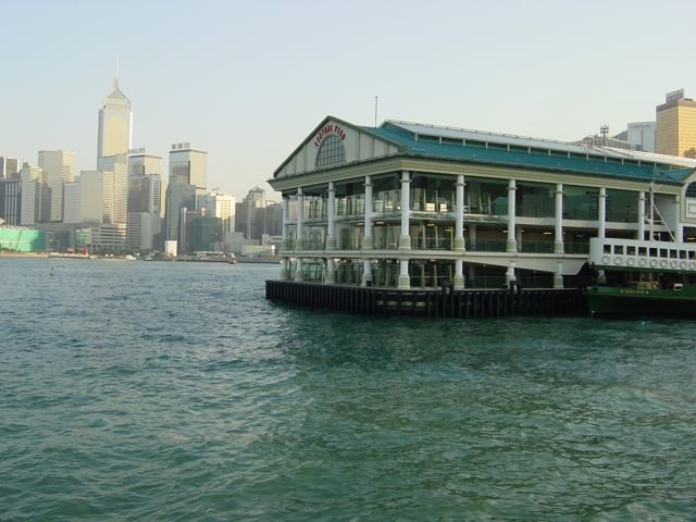 Star Ferry pier in Tsim Sha Tsui with Hong Kong Island skyline across the harbour