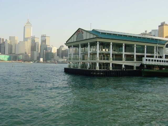 Star Ferry pier in Tsim Sha Tsui with Hong Kong Island skyline across the harbour