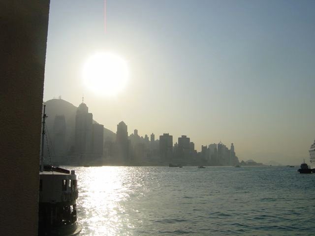 Hong Kong Island skyline silhouetted at sunset from the Star Ferry