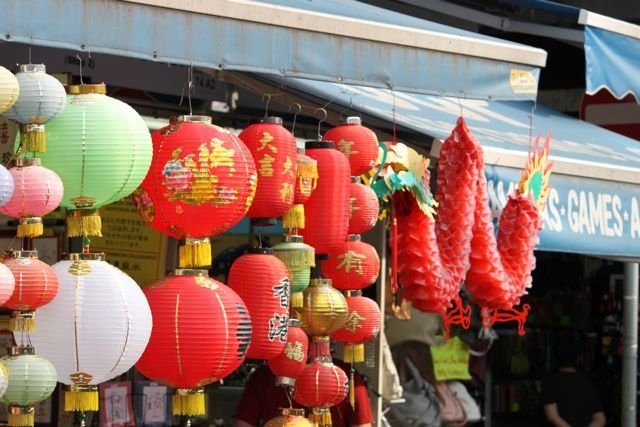 Chinese lanterns and decorations hanging outside a market stall