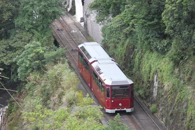 The Peak Tram climbing through greenery on the hillside