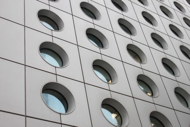 Building facade with rows of circular porthole windows
