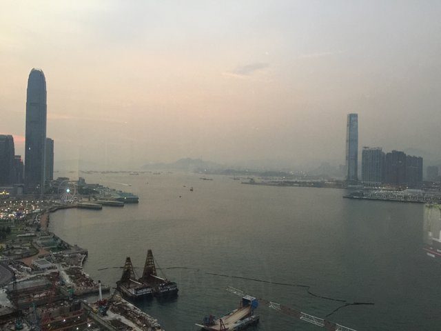 Victoria Harbour at dusk, IFC tower left, ICC right, hazy sky