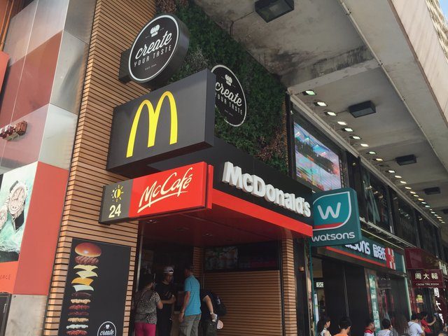 McDonald's and McCafé signs on a busy Hong Kong street