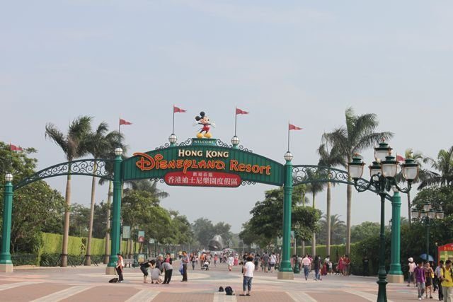 Hong Kong Disneyland Resort entrance arch with visitors