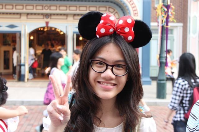 Visitor wearing Minnie Mouse ears at Hong Kong Disneyland